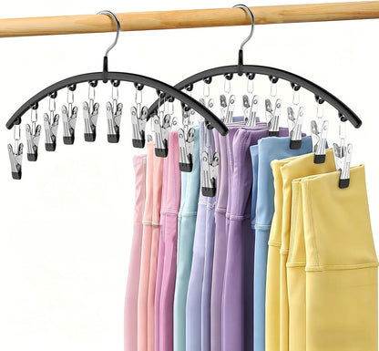 Two black metal legging organizer hangers