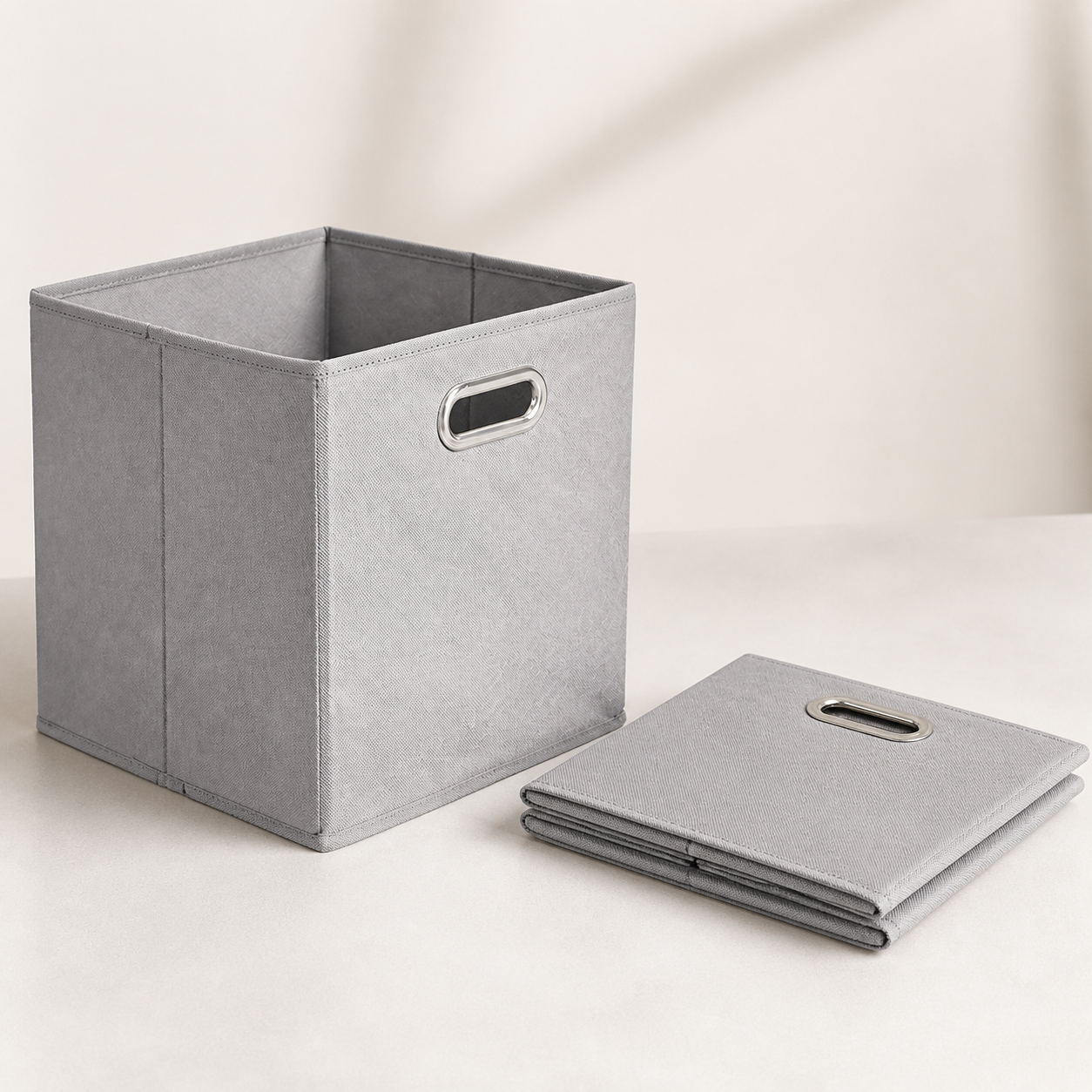 Light gray fabric storage cube shown open and folded flat