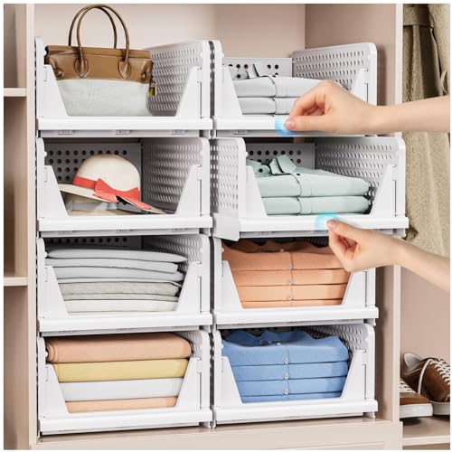 White foldable storage baskets organizing folded clothes