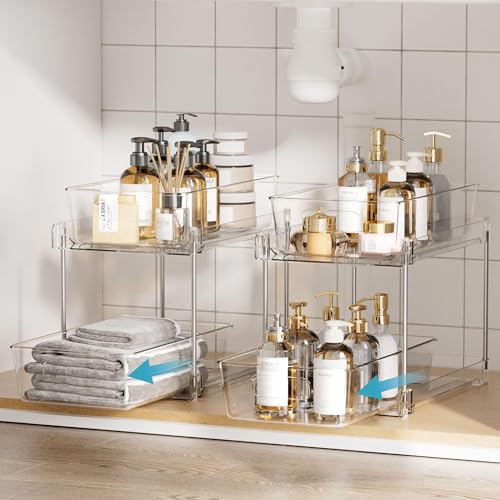Clear two-tier organizers holding bottles on a bathroom countertop