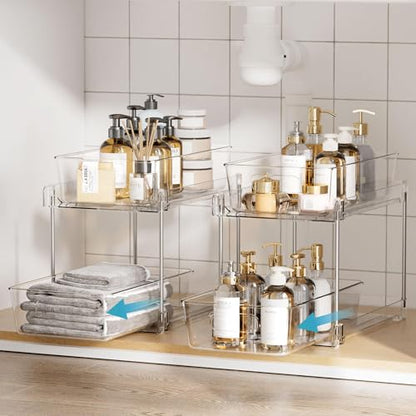 Clear two-tier organizers holding bottles on a bathroom countertop